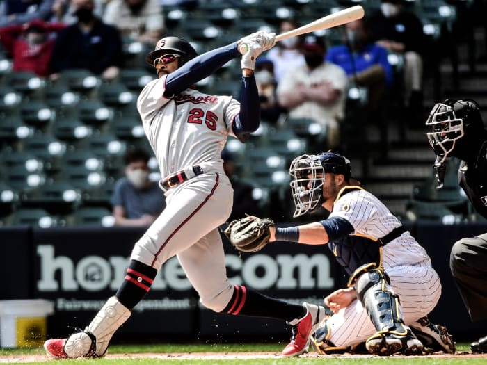 Apr 4, 2021; Milwaukee, Wisconsin, USA; Minnesota Twins center fielder Byron Buxton (25) hits a double in the first inning as Milwaukee Brewers catcher Manny Pina (9) watches at American Family Field.